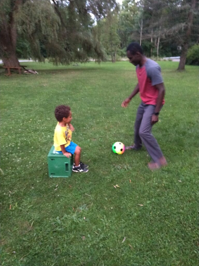 father and son time playing soccer